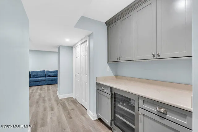 a wooden bench sitting in front of a building