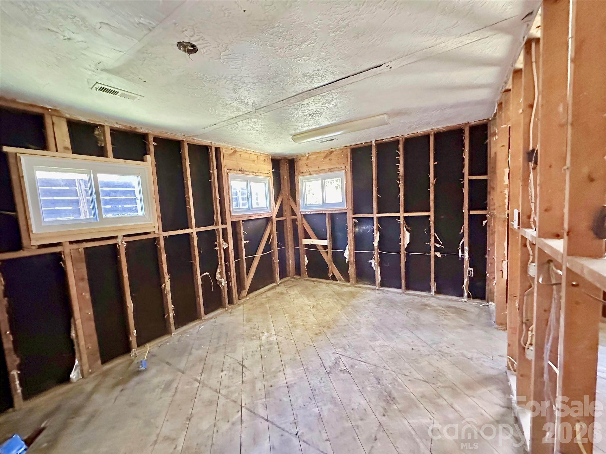 402 Blue Ridge Road Black Mountain, NC 28711 - Photo 13 of 18 a view of a hallway with workspace