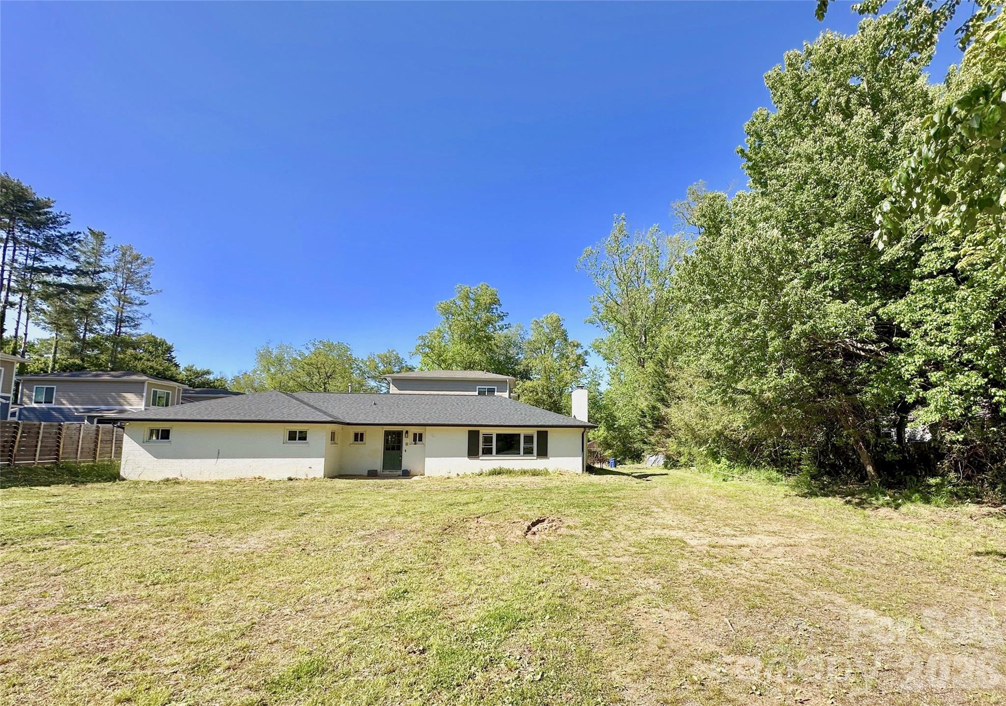 402 Blue Ridge Road Black Mountain, NC 28711 - Photo 16 of 18 a front view of a house with a yard