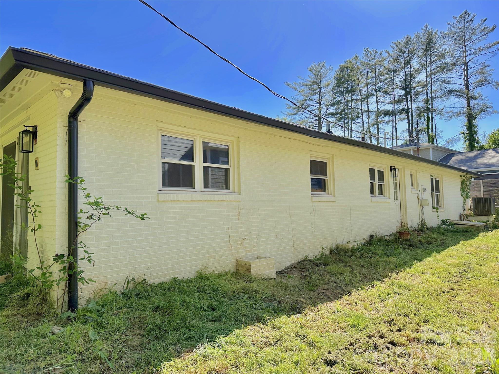 402 Blue Ridge Road Black Mountain, NC 28711 - Photo 17 of 18 a front view of a house with a yard