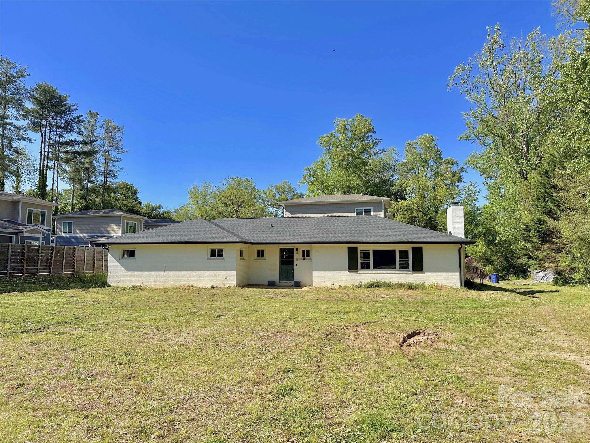 402 Blue Ridge Road Black Mountain, NC 28711 - Photo 2 of 18 a front view of a house with a yard