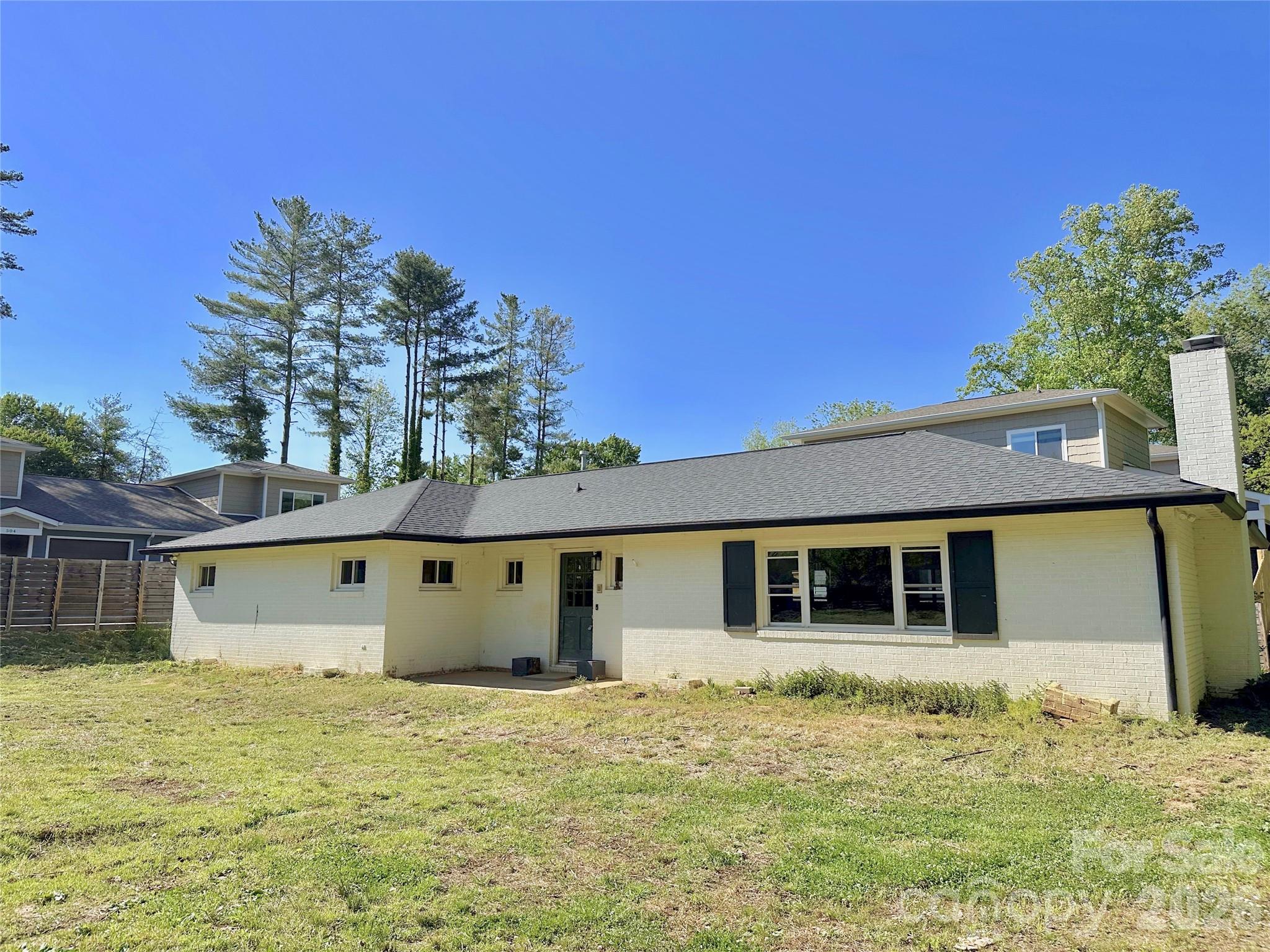402 Blue Ridge Road Black Mountain, NC 28711 - Photo 3 of 18 front view of a house with a yard