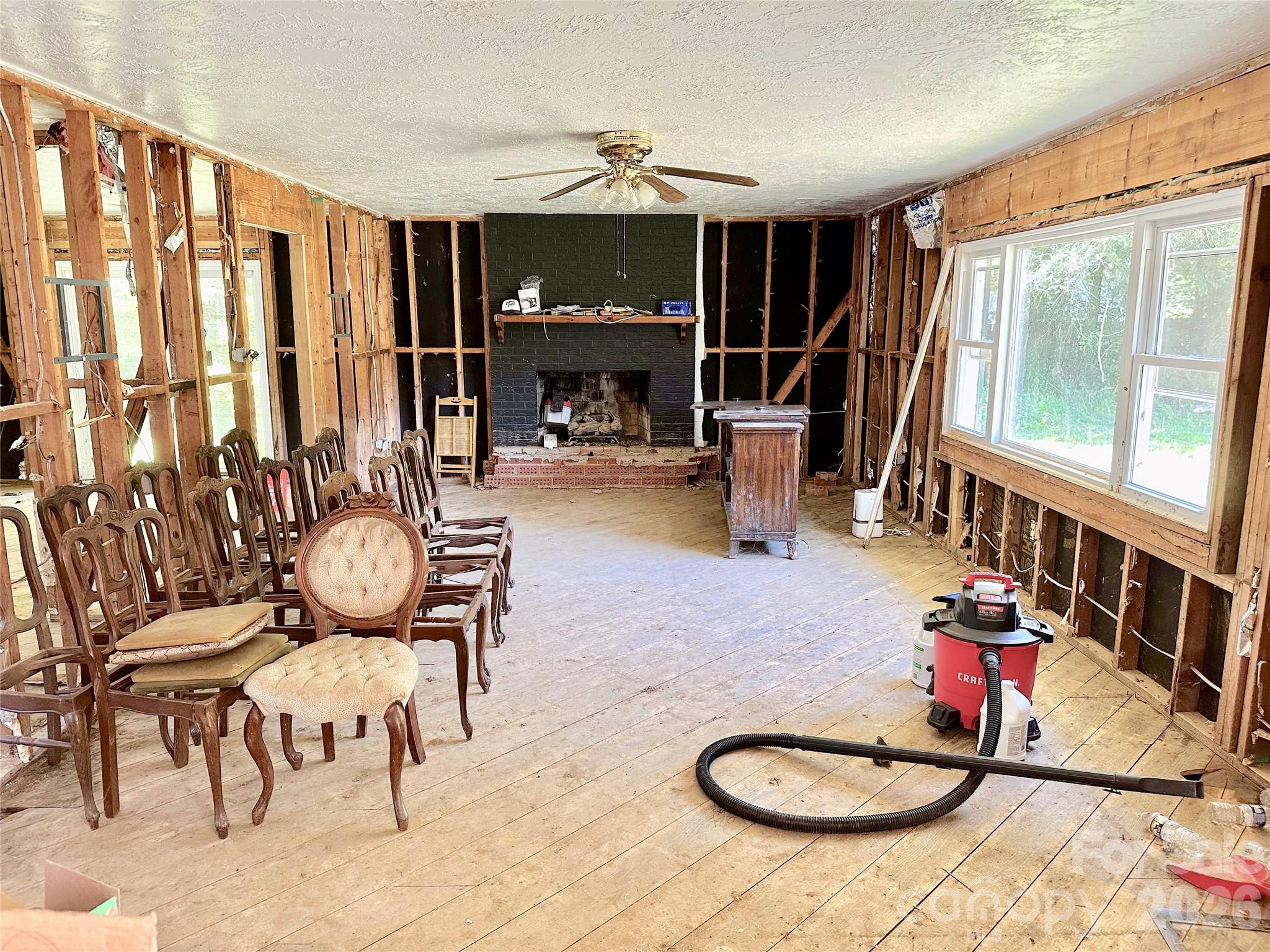 402 Blue Ridge Road Black Mountain, NC 28711 - Photo 4 of 18 a living room with furniture and a fireplace