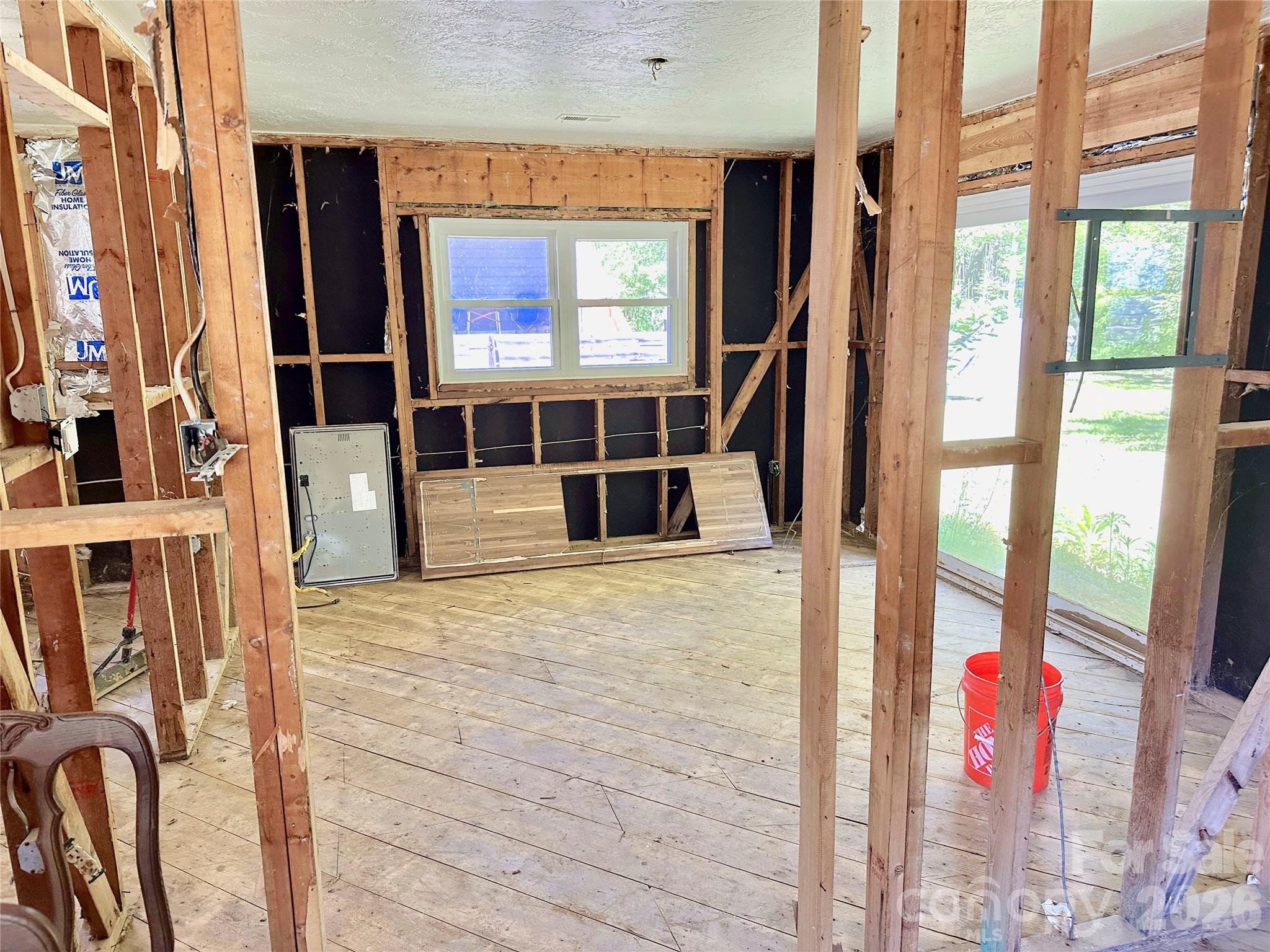 402 Blue Ridge Road Black Mountain, NC 28711 - Photo 5 of 18 a view of an entryway with wooden floor and door