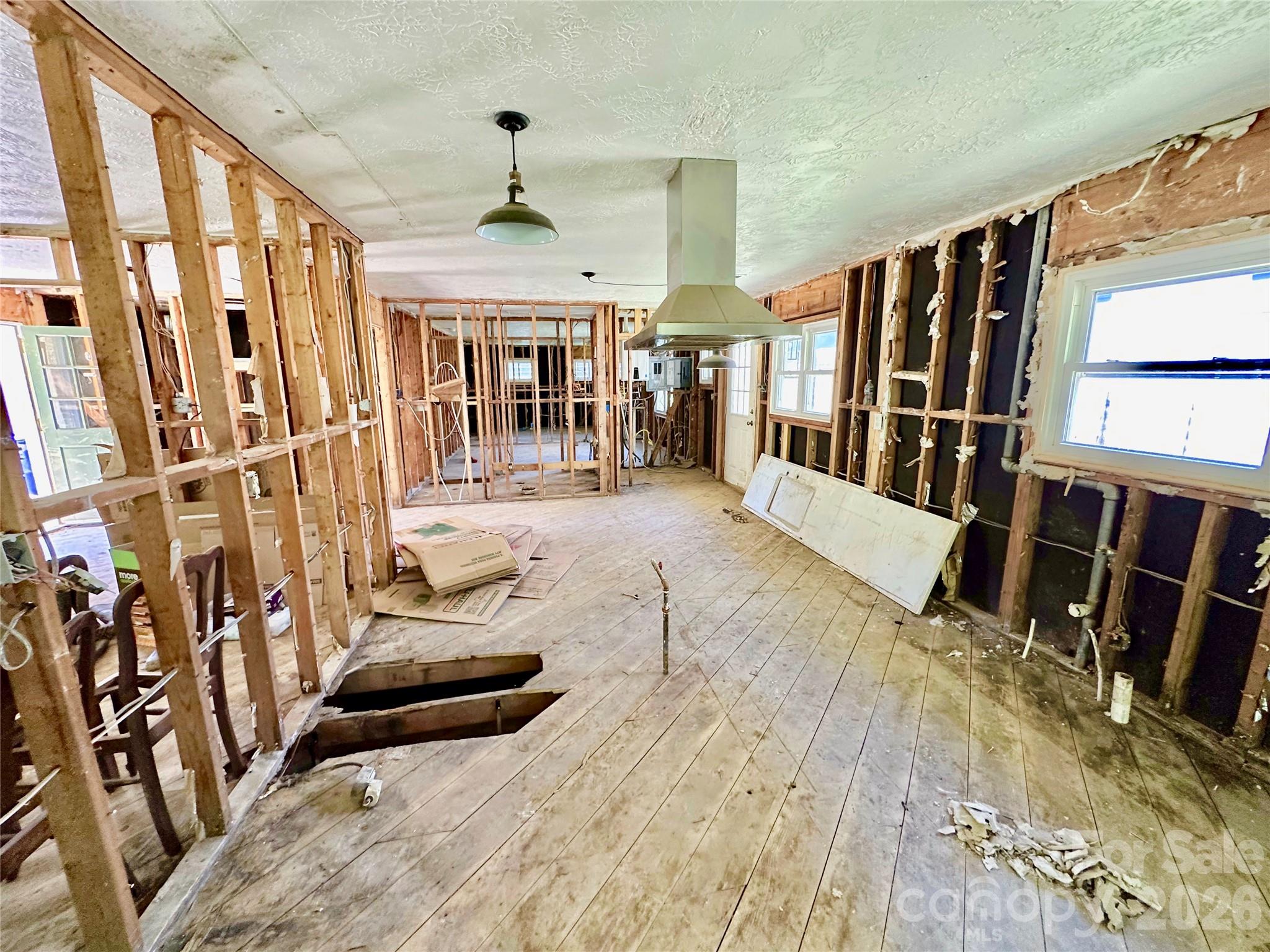 402 Blue Ridge Road Black Mountain, NC 28711 - Photo 6 of 18 a view of an entryway with wooden floor and windows
