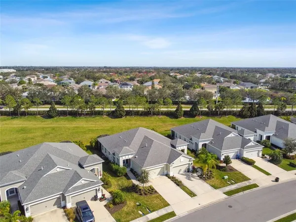 an aerial view of a house with a ocean view