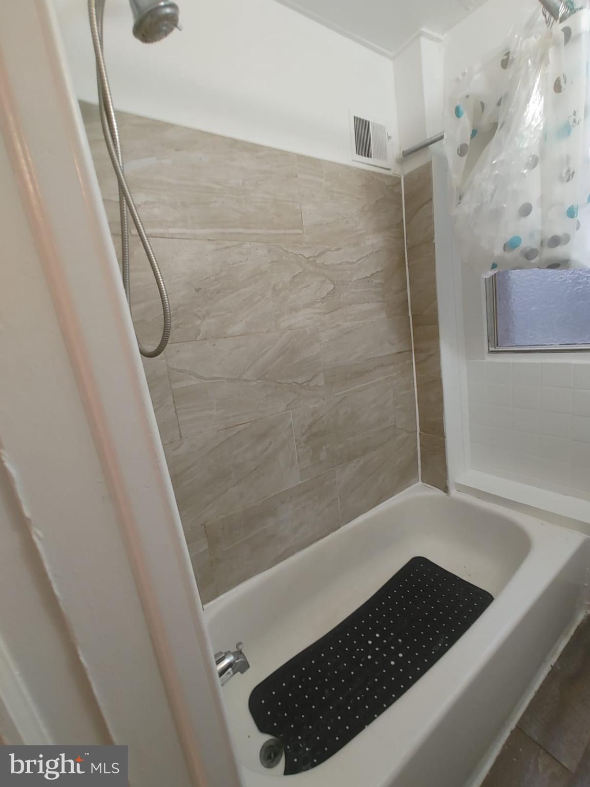 208-210 North Avondale Street Philadelphia, PA 19139 - Photo 8 of 15 a bathroom with a shower