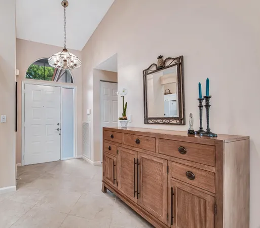 a spacious bathroom with double vanity and a mirror