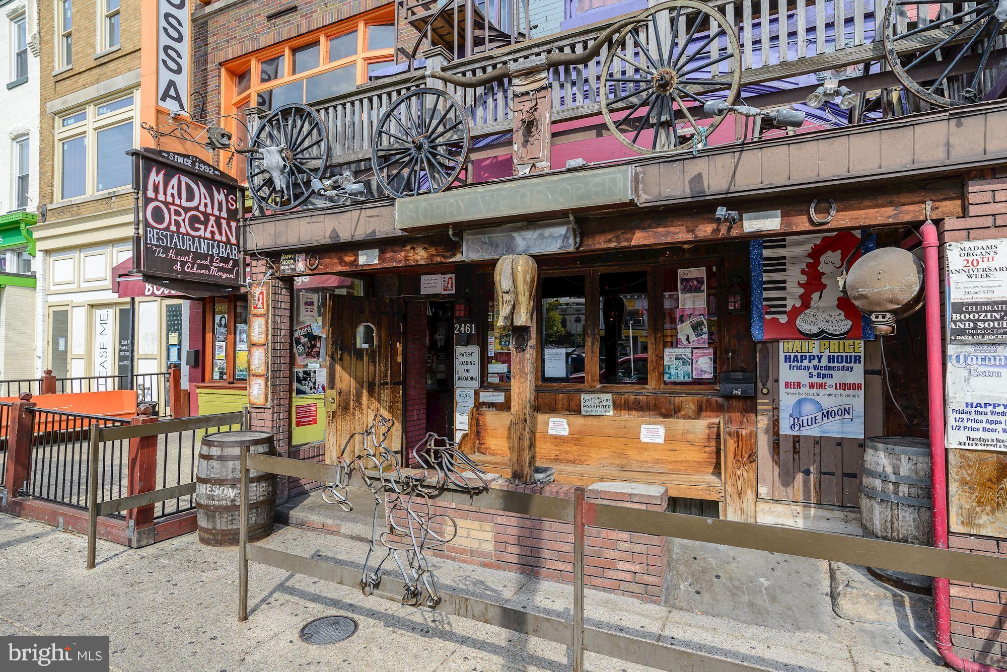 2707 Adams Mill Road Northwest, Unit 303 Washington, DC 20009 - Photo 27 of 27 a view of street with shops