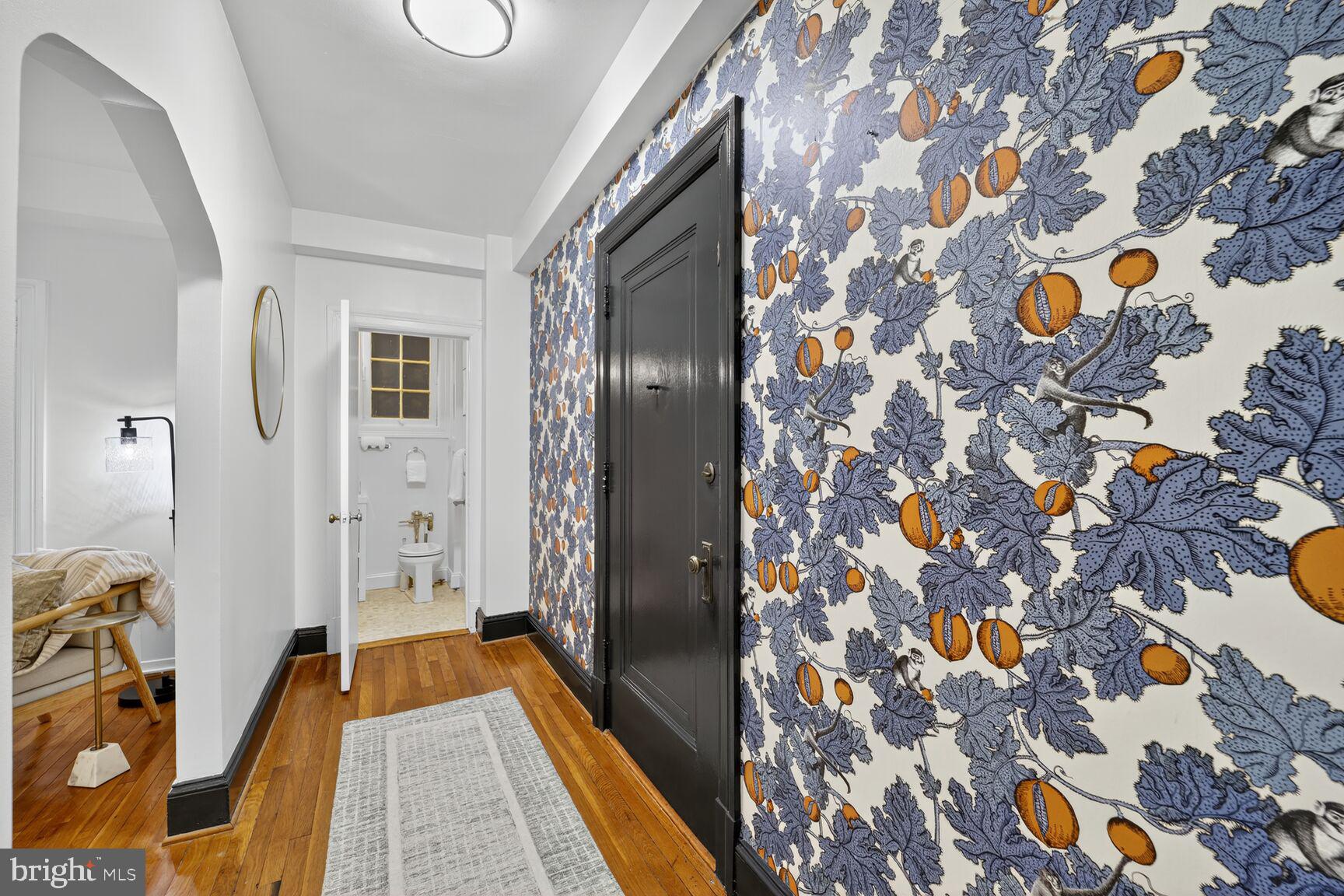 2707 Adams Mill Road Northwest, Unit 303 Washington, DC 20009 - Photo 8 of 27 a bathroom with a sink and mirror