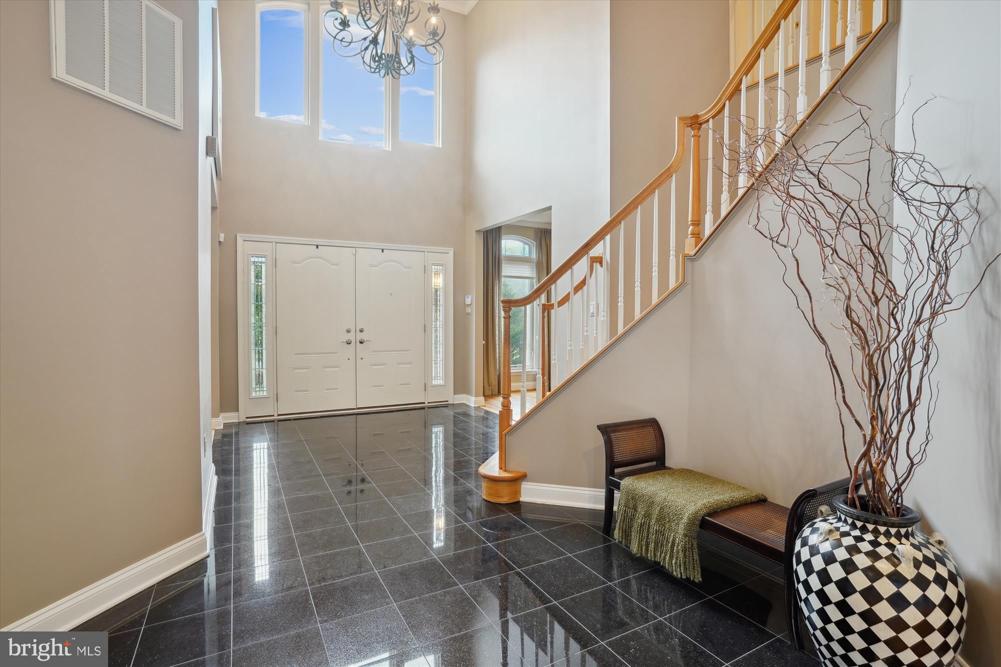 17410 Queen Anne Road Upper Marlboro, MD 20774 - Photo 17 of 82 a living room with couches and a dining table with wooden floor