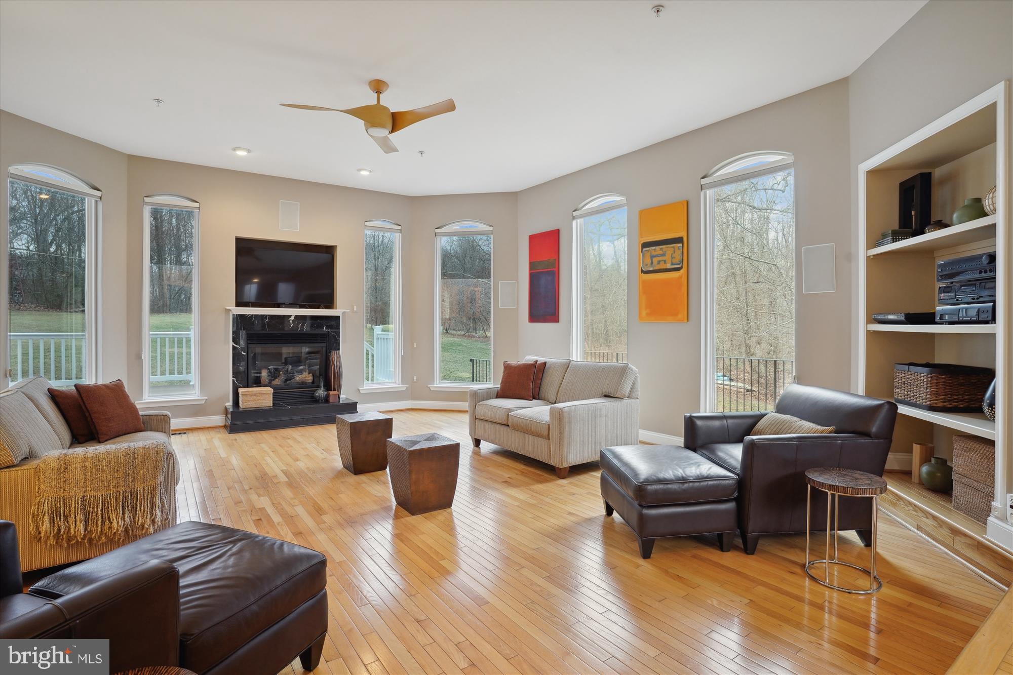 17410 Queen Anne Road Upper Marlboro, MD 20774 - Photo 22 of 82 a living room with fireplace furniture and a flat screen tv