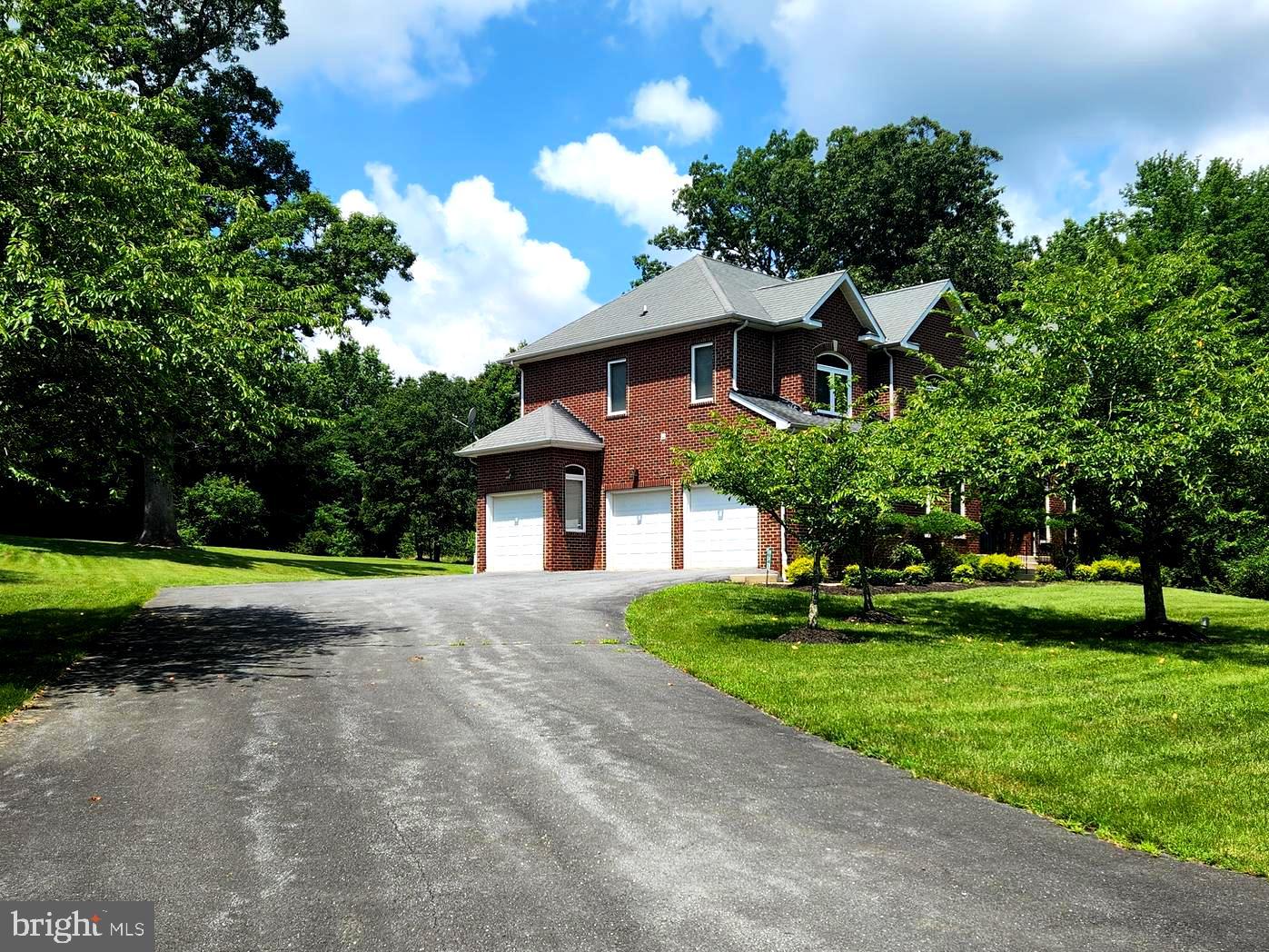 17410 Queen Anne Road Upper Marlboro, MD 20774 - Photo 3 of 82 a front view of a house with a yard