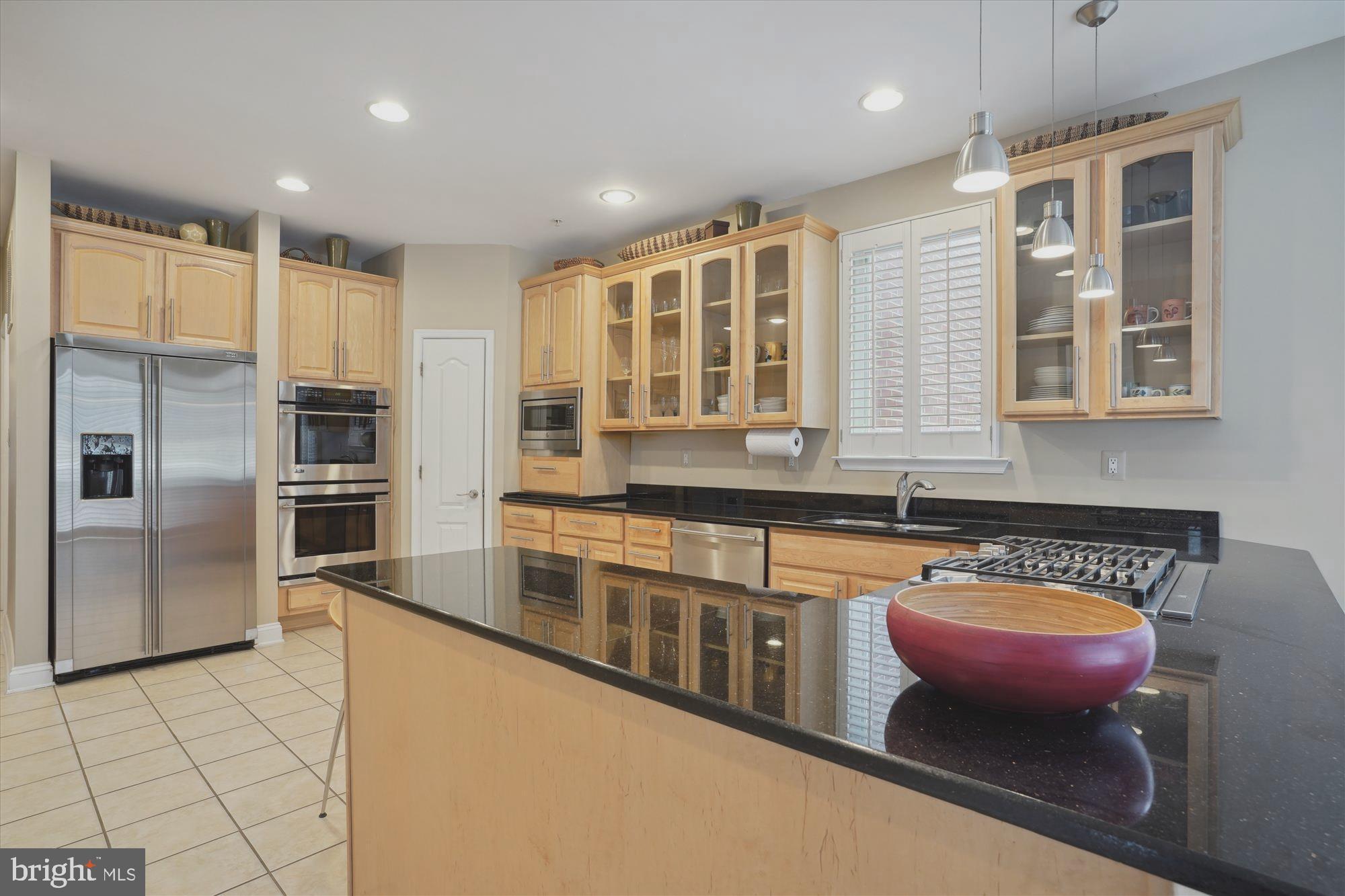 17410 Queen Anne Road Upper Marlboro, MD 20774 - Photo 31 of 82 a kitchen with stainless steel appliances granite countertop a sink and a refrigerator