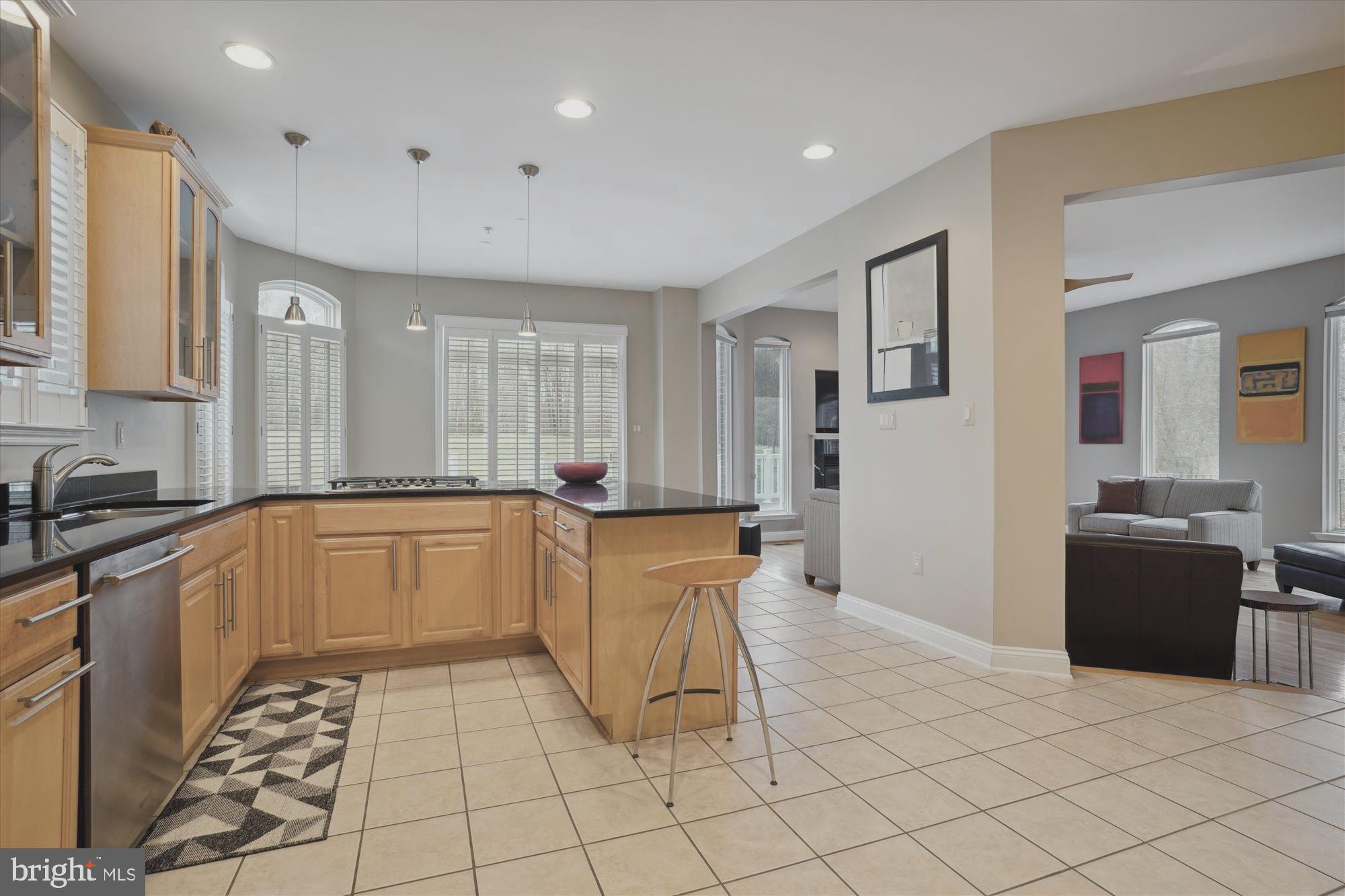 17410 Queen Anne Road Upper Marlboro, MD 20774 - Photo 33 of 82 a large white kitchen with cabinets and a stove top oven