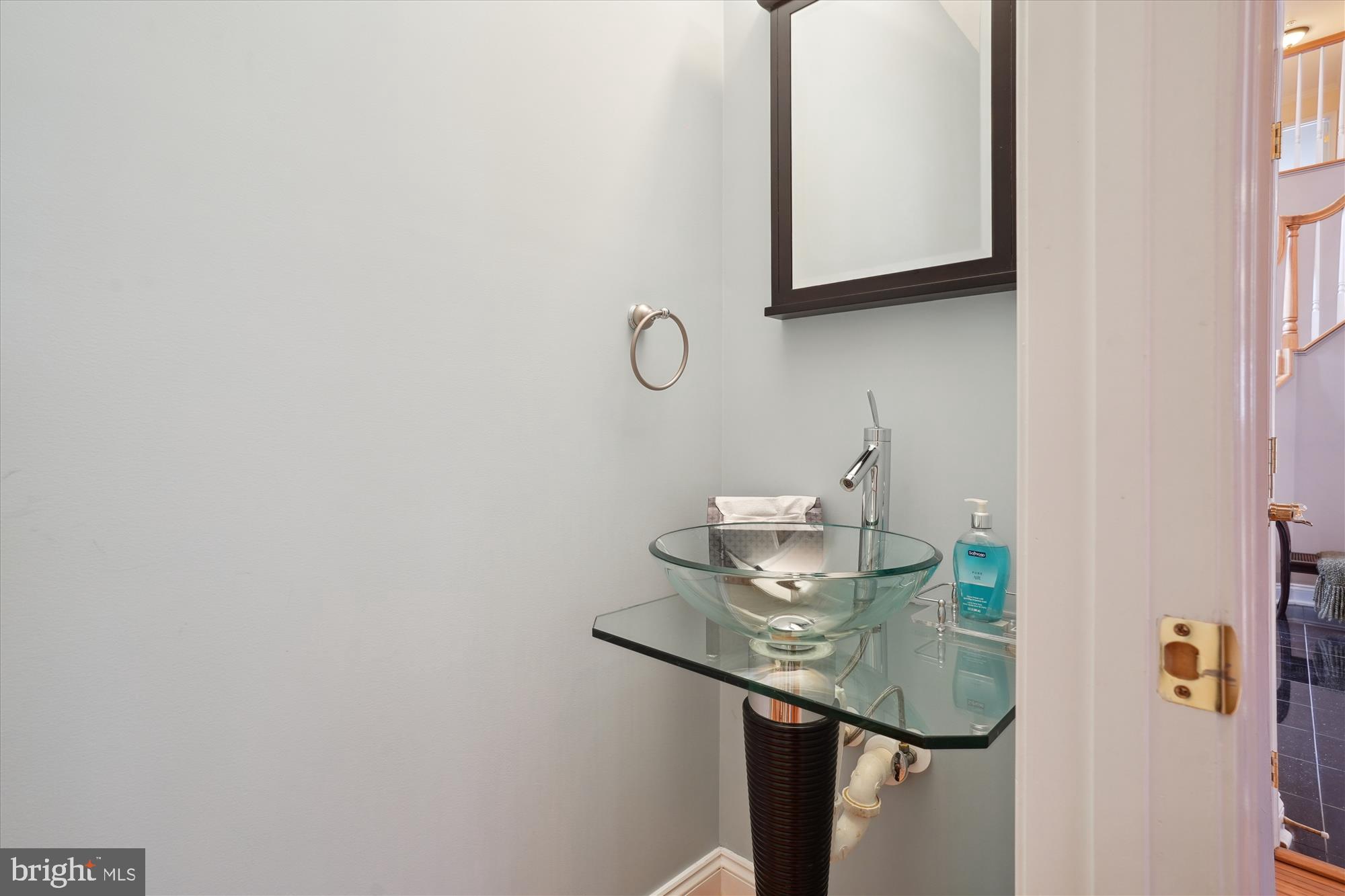 17410 Queen Anne Road Upper Marlboro, MD 20774 - Photo 38 of 82 a bathroom with a sink and a mirror