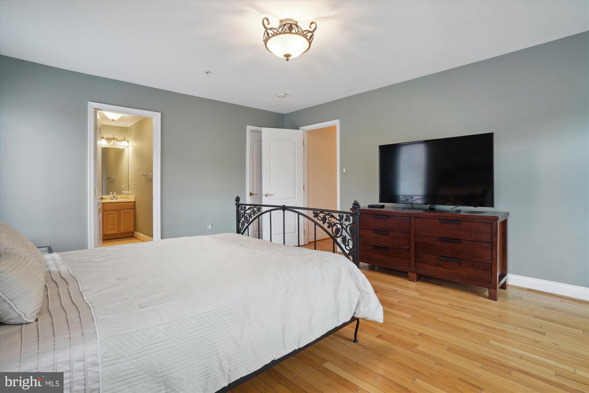 17410 Queen Anne Road Upper Marlboro, MD 20774 - Photo 49 of 82 a bedroom with a bed and a flat screen tv