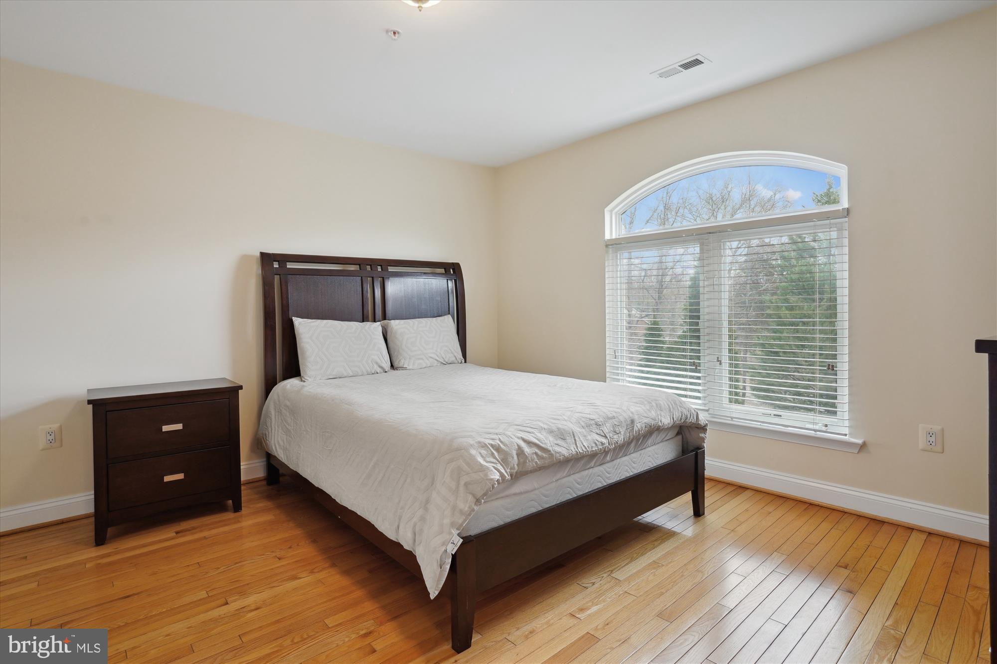 17410 Queen Anne Road Upper Marlboro, MD 20774 - Photo 51 of 82 a large bed sitting in a bedroom next to a window