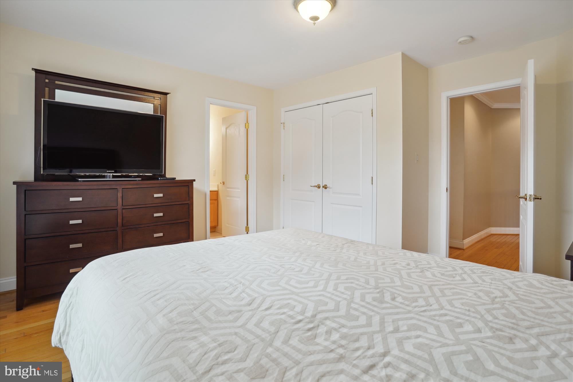 17410 Queen Anne Road Upper Marlboro, MD 20774 - Photo 52 of 82 a bedroom with a bed and a flat screen tv in it