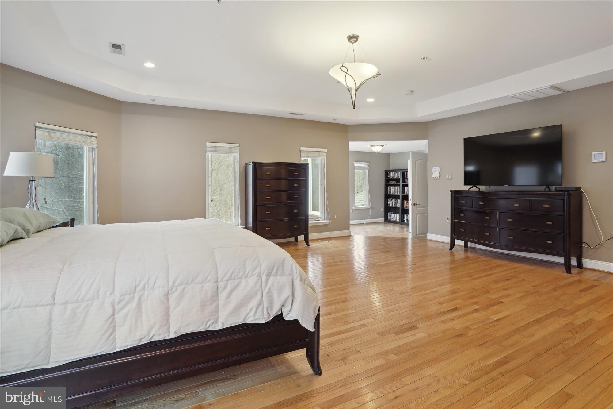 17410 Queen Anne Road Upper Marlboro, MD 20774 - Photo 55 of 82 a spacious bedroom with a bed and a flat screen television
