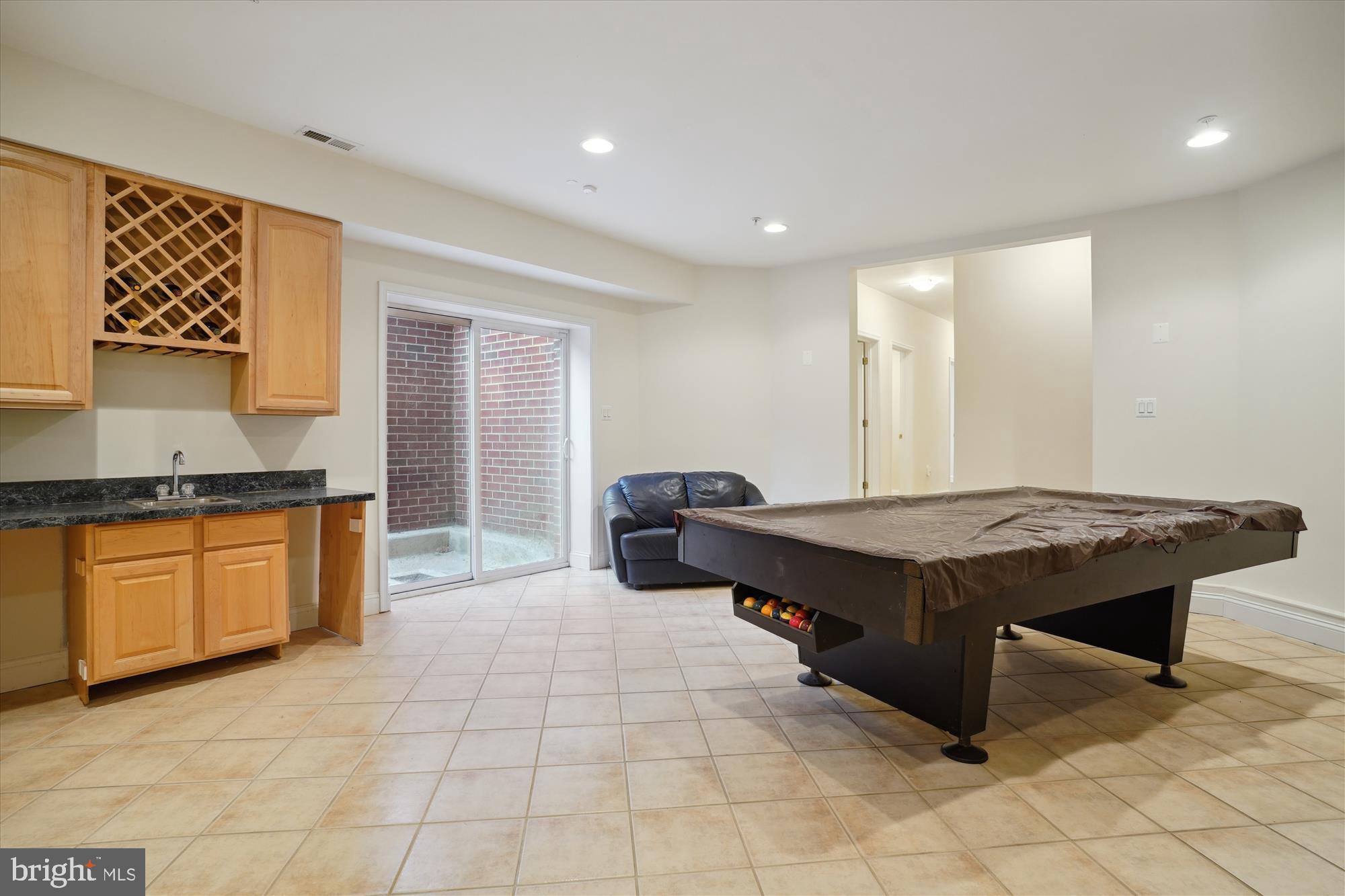 17410 Queen Anne Road Upper Marlboro, MD 20774 - Photo 74 of 82 a spacious bathroom with a granite countertop sink and a mirror