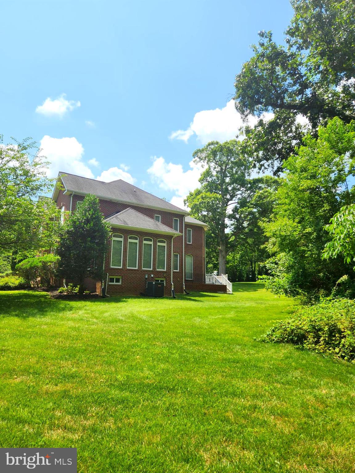 17410 Queen Anne Road Upper Marlboro, MD 20774 - Photo 79 of 82 a front view of a house with a yard and trees