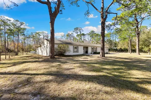 a house with trees in the background