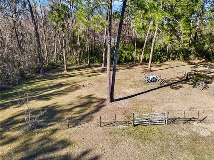a view of a patio with table and chairs