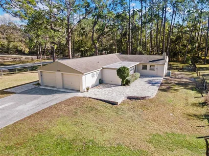a view of a livingroom with wooden floor and a window