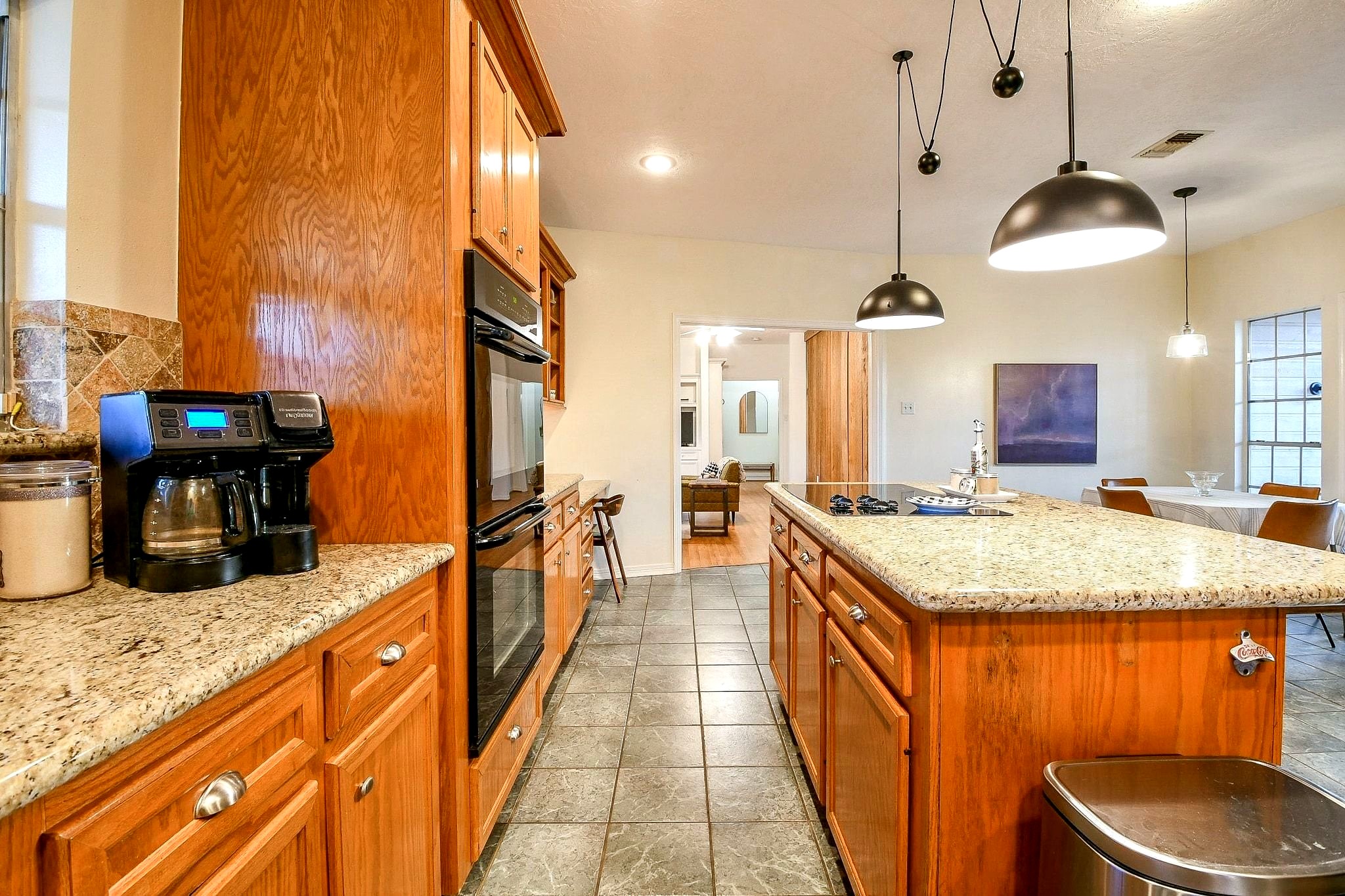22035 Buescher Road Tomball, TX 77377 - Photo 12 of 43 a kitchen with stainless steel appliances granite countertop a sink and a wooden floors
