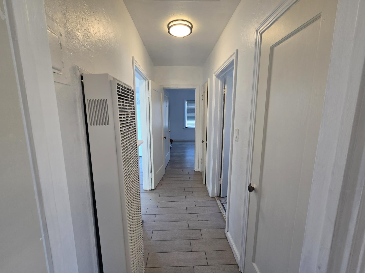 320 North Sanborn Road Salinas, CA 93905 - Photo 17 of 26 a view of a hallway with wooden shelves