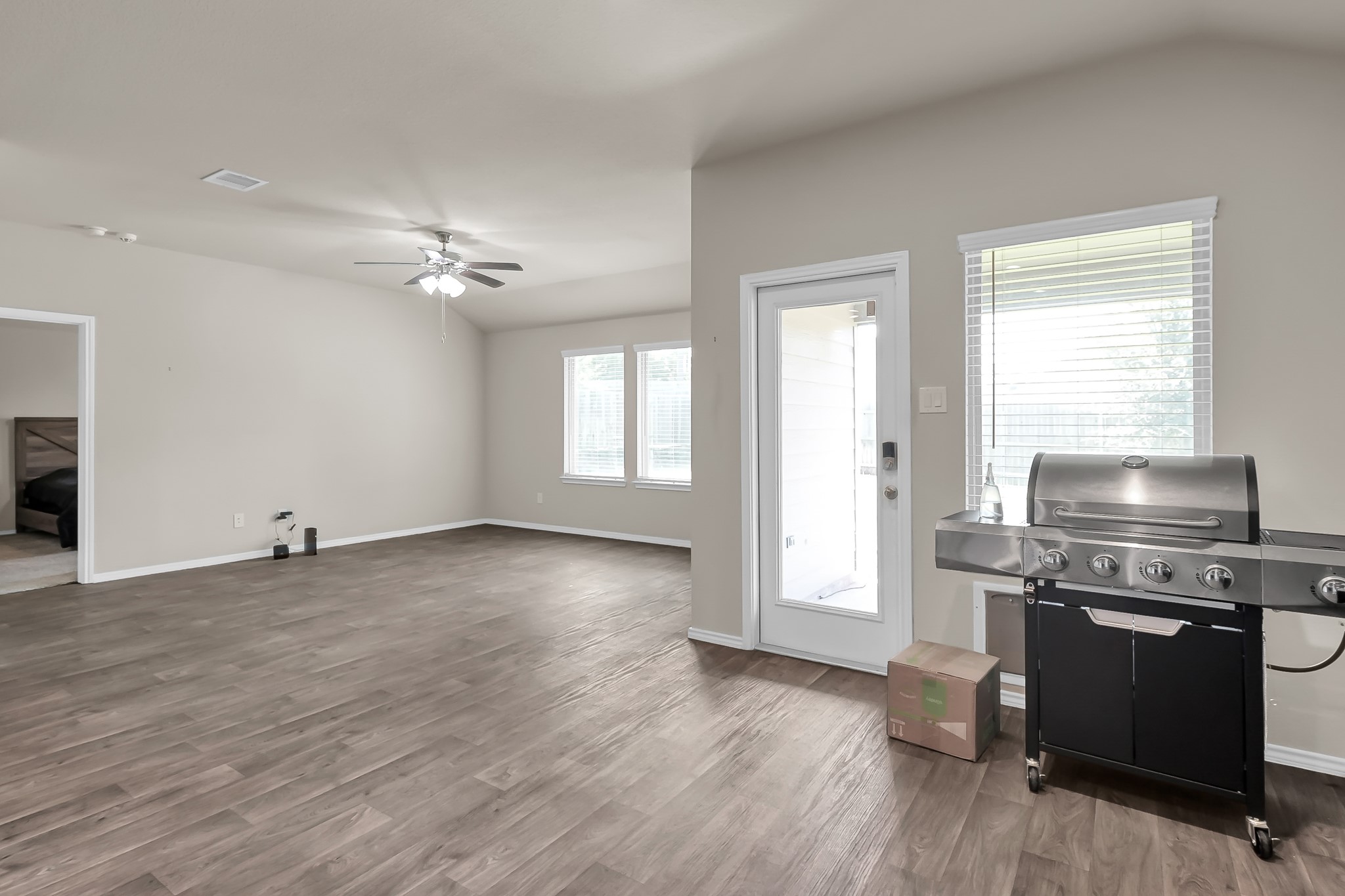 15015 Monserrat Lane Conroe, TX 77304 - Photo 15 of 41 a view of a kitchen with a stove wooden floor and a window