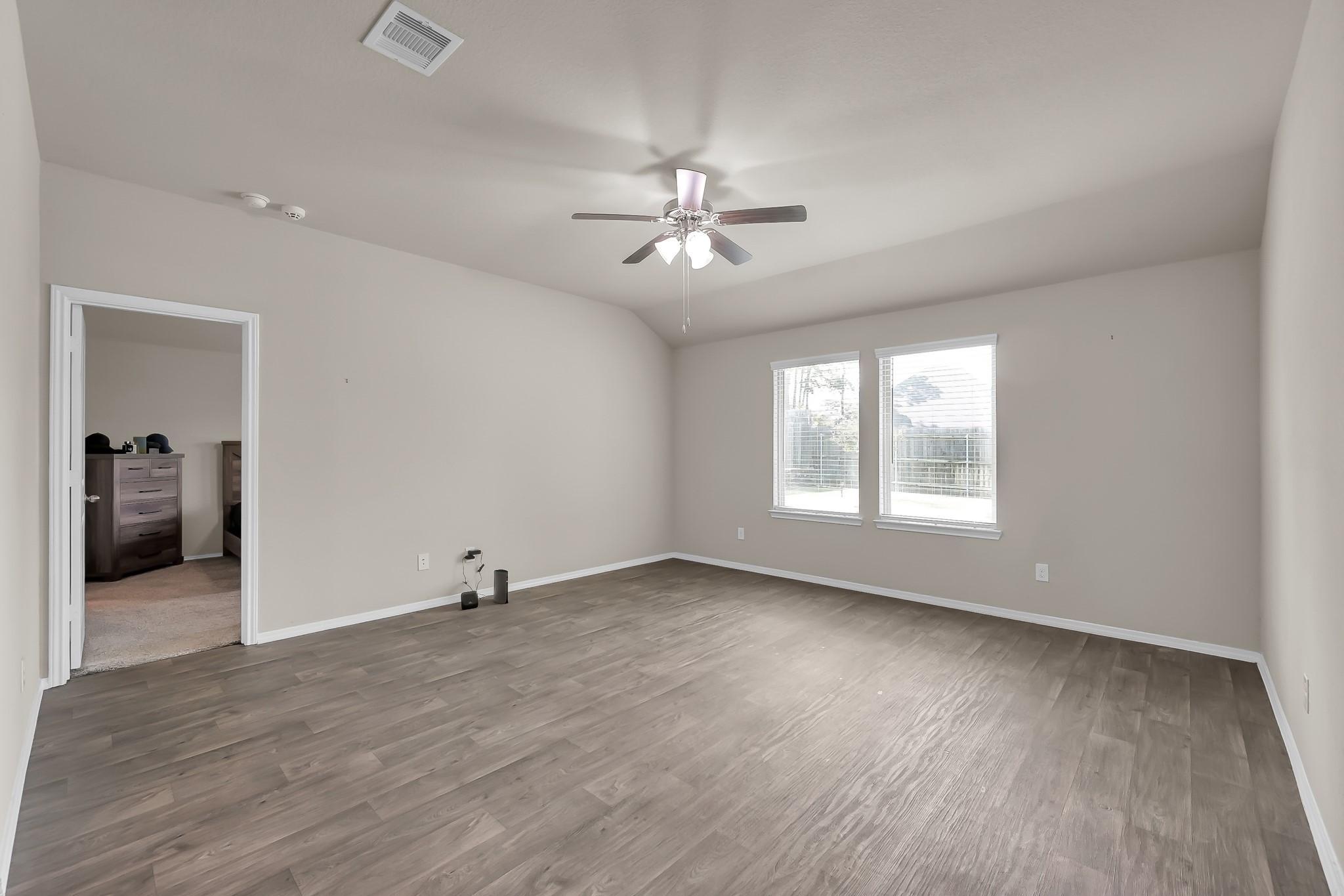 15015 Monserrat Lane Conroe, TX 77304 - Photo 17 of 41 wooden floor in an empty room with a window