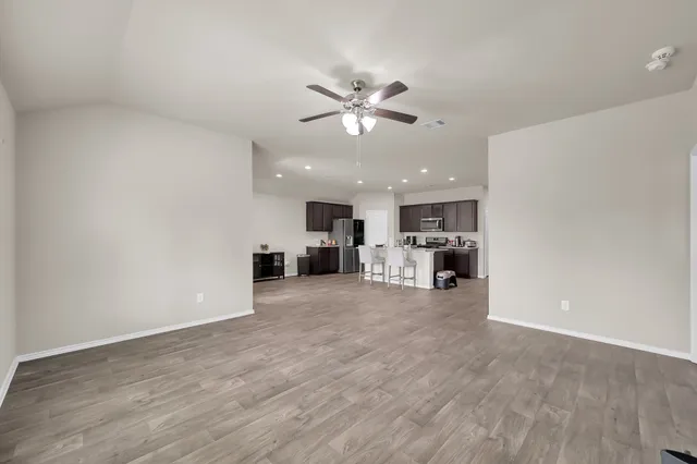 a bedroom with a bed and flat screen tv
