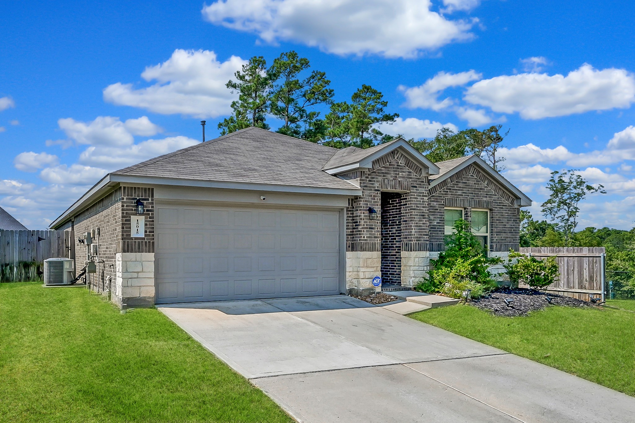 15015 Monserrat Lane Conroe, TX 77304 - Photo 2 of 41 front view of house with a yard