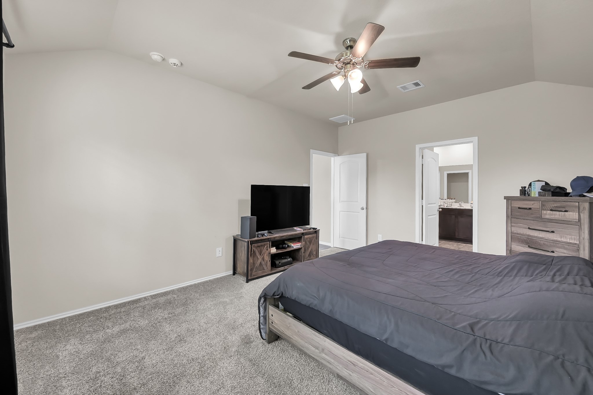 15015 Monserrat Lane Conroe, TX 77304 - Photo 22 of 41 a bedroom with a bed and flat screen tv