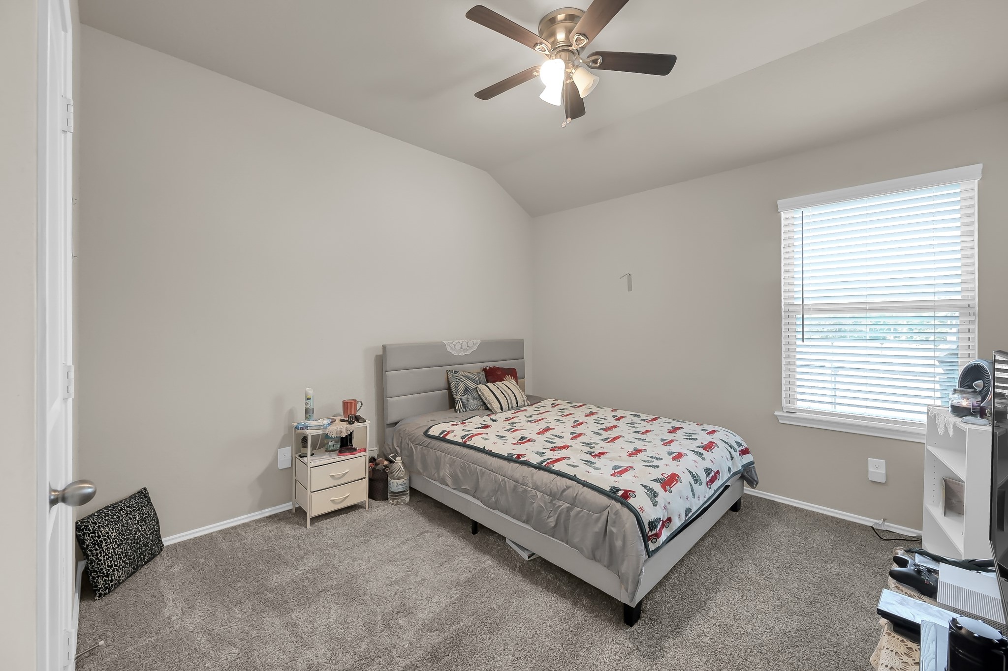 15015 Monserrat Lane Conroe, TX 77304 - Photo 28 of 41 a bedroom with a bed and a window