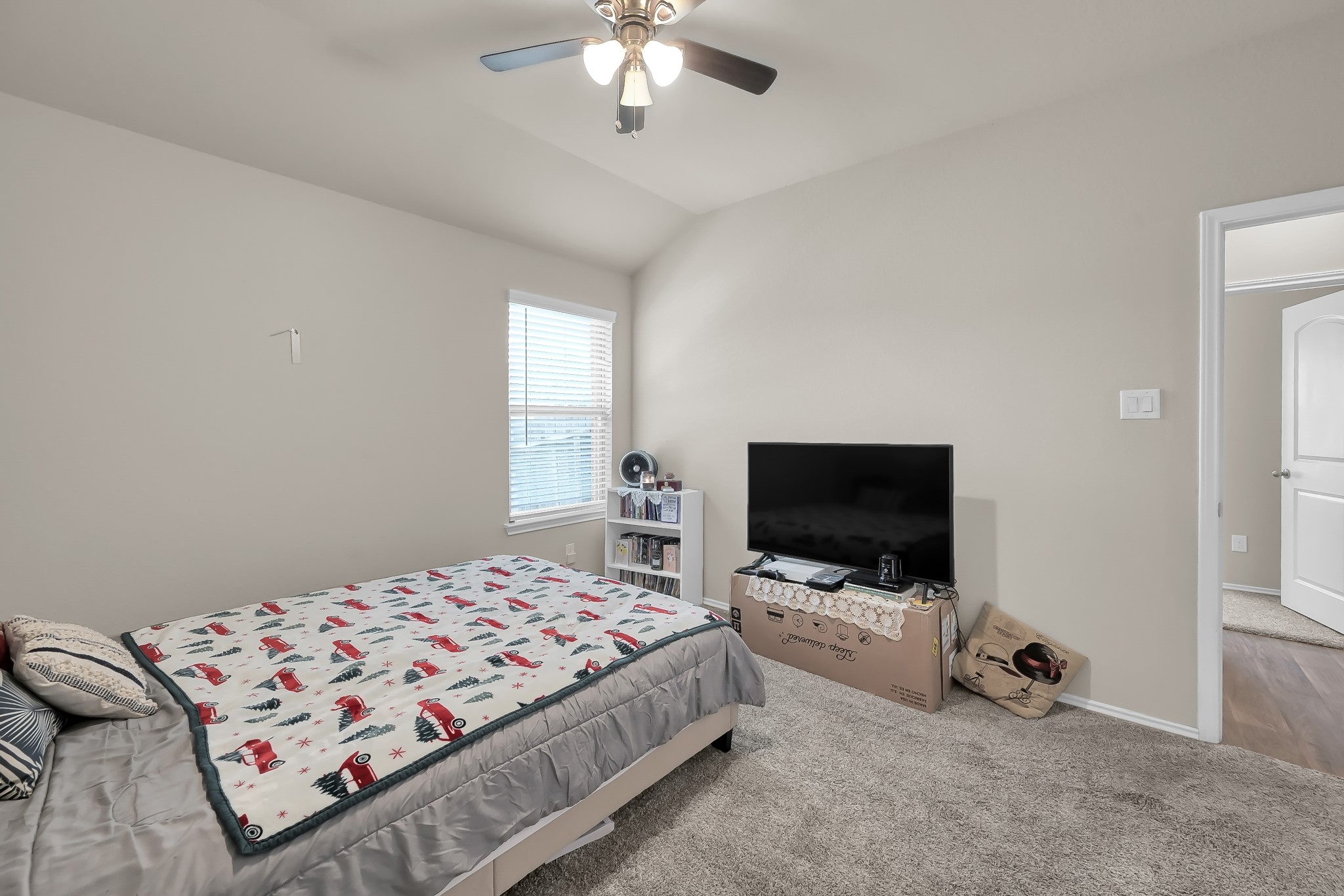 15015 Monserrat Lane Conroe, TX 77304 - Photo 29 of 41 a bedroom with a bed and a flat screen tv