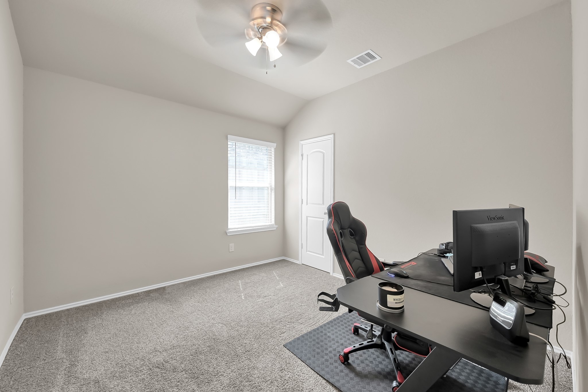 15015 Monserrat Lane Conroe, TX 77304 - Photo 30 of 41 a view of a workspace with furniture and a window