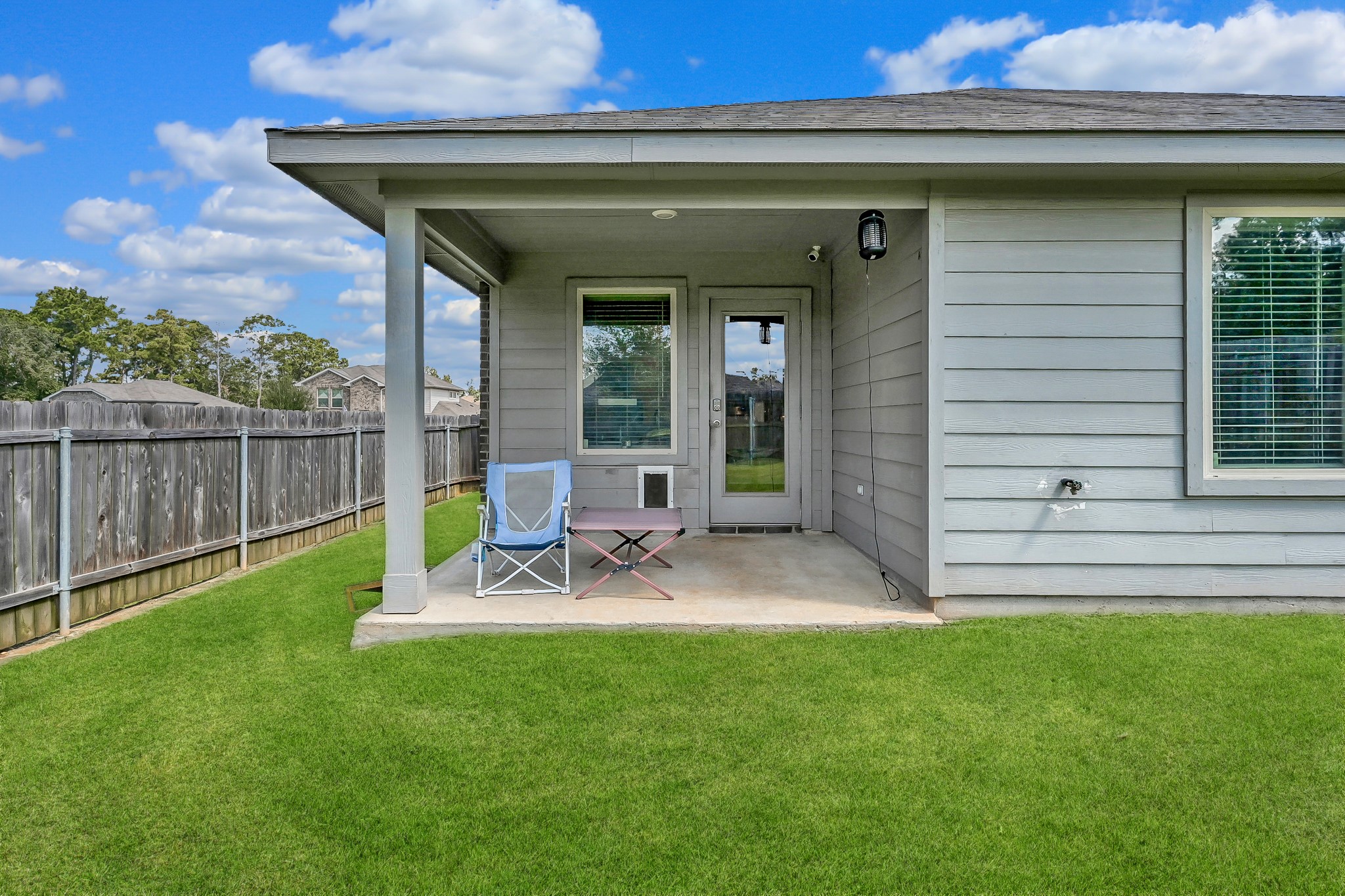 15015 Monserrat Lane Conroe, TX 77304 - Photo 33 of 41 a view of a chair and table in patio of the house