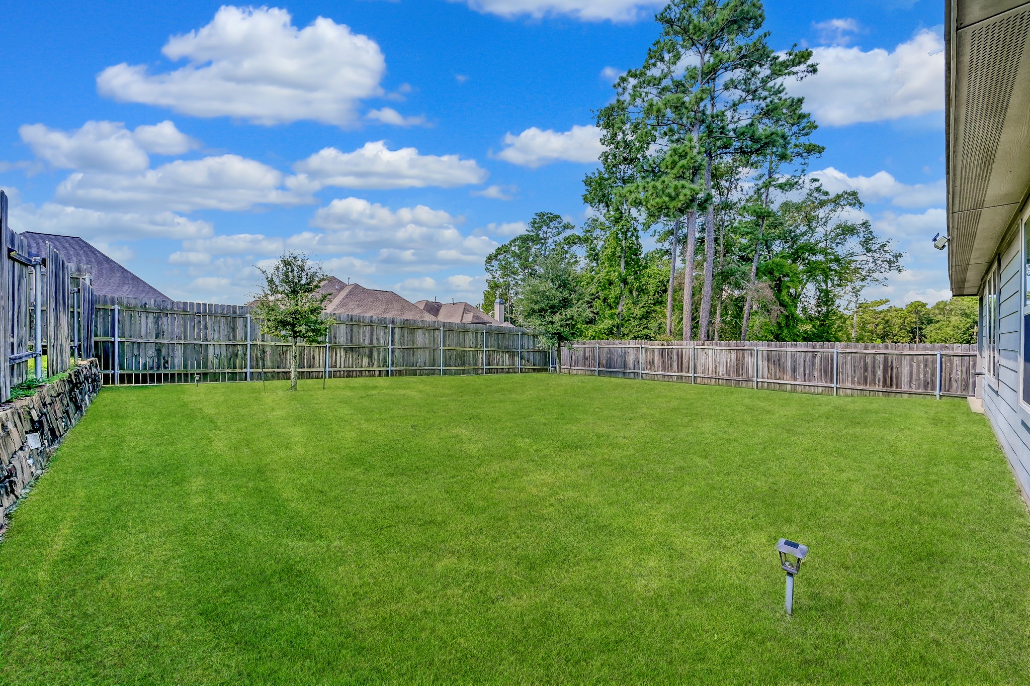15015 Monserrat Lane Conroe, TX 77304 - Photo 35 of 41 a view of yard with swimming pool and green space