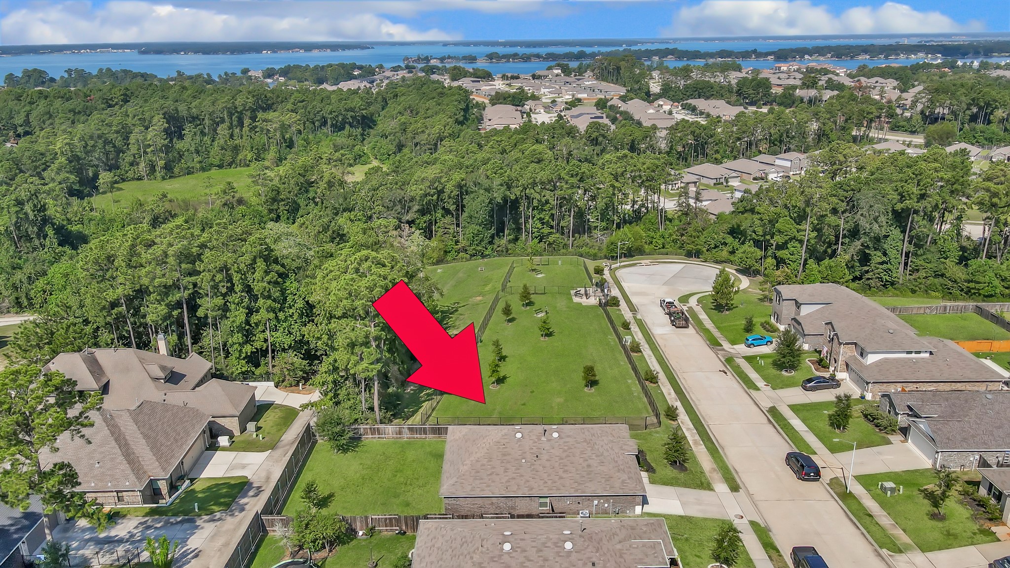 15015 Monserrat Lane Conroe, TX 77304 - Photo 5 of 41 an aerial view of a houses with a green and yard
