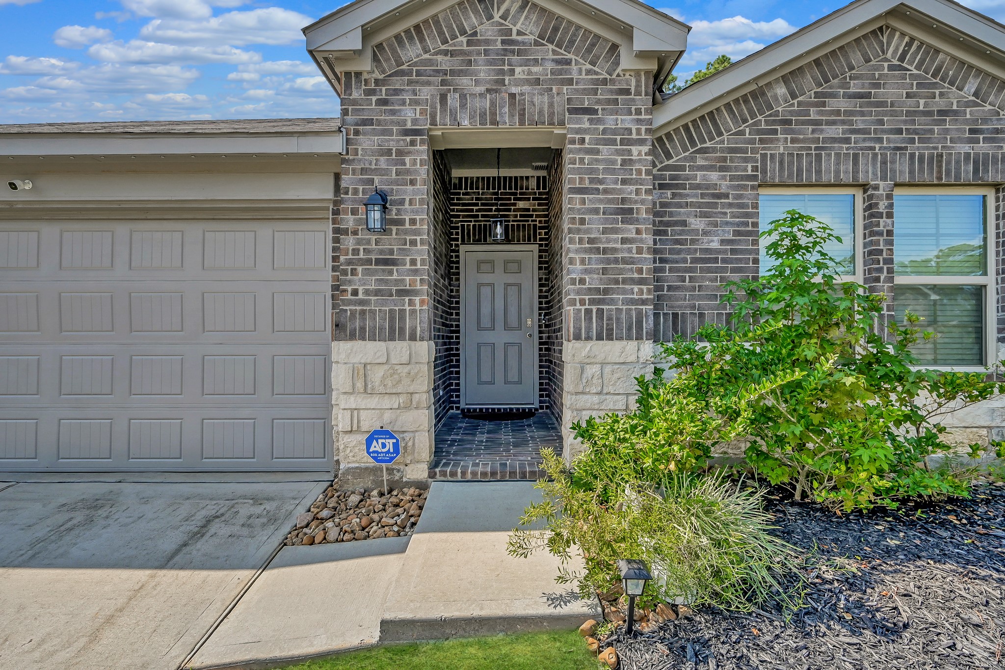 15015 Monserrat Lane Conroe, TX 77304 - Photo 6 of 41 a view of entrance gate of a house