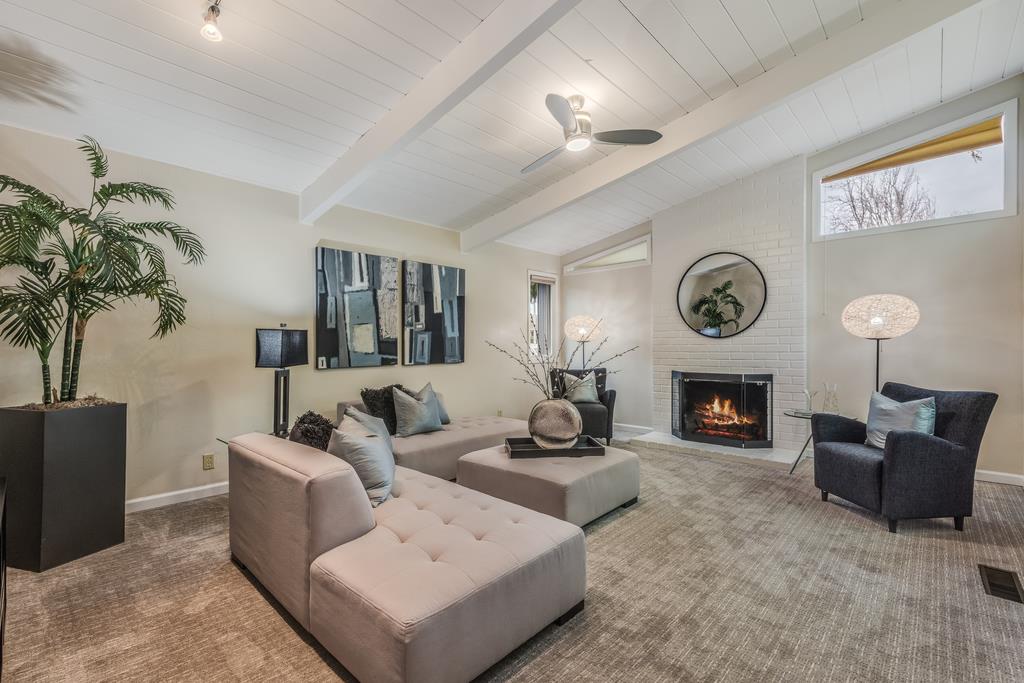 1372 Flicker Way Sunnyvale, CA 94087 - Photo 19 of 22 a living room with furniture and a fireplace