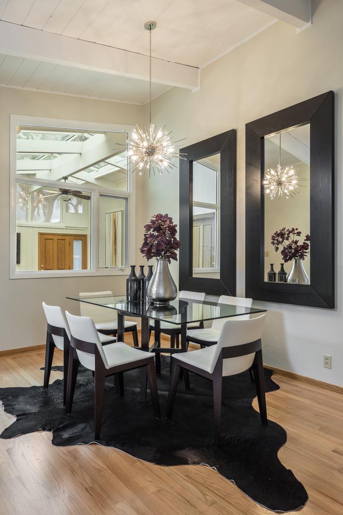1372 Flicker Way Sunnyvale, CA 94087 - Photo 7 of 22 a view of a dining room with furniture and chandelier