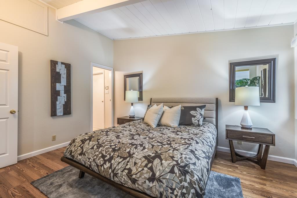 1372 Flicker Way Sunnyvale, CA 94087 - Photo 9 of 22 a bedroom with a bed a table and chair