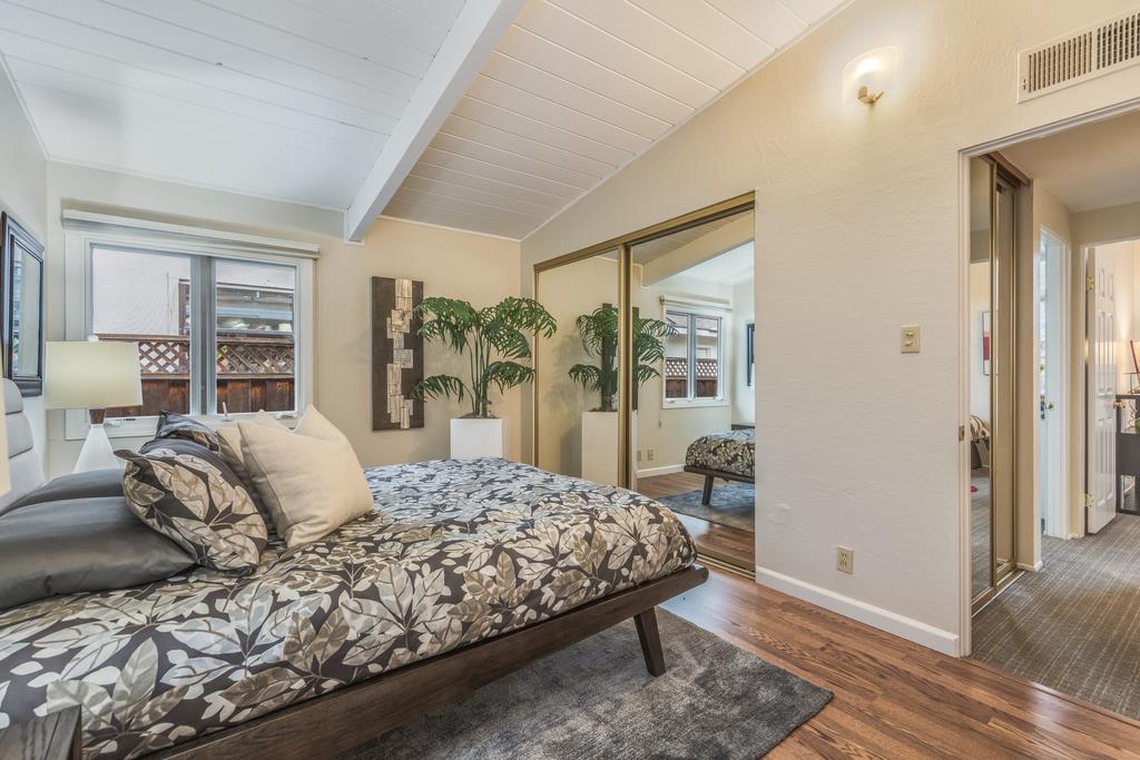 1372 Flicker Way Sunnyvale, CA 94087 - Photo 10 of 22 a bedroom with a large bed and a large window
