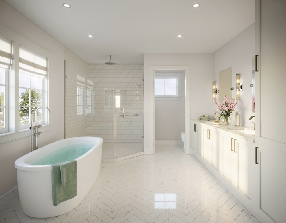 371 Marrett Road Lexington, MA 02421 - Photo 3 of 8 a spacious bathroom with a tub sink shower and mirror