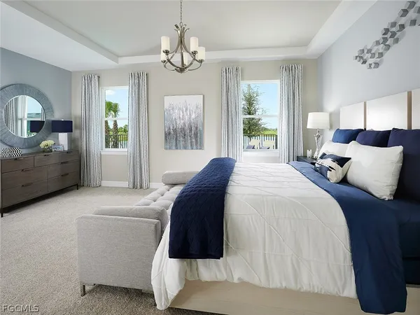 a spacious bedroom with a bed mirror and window