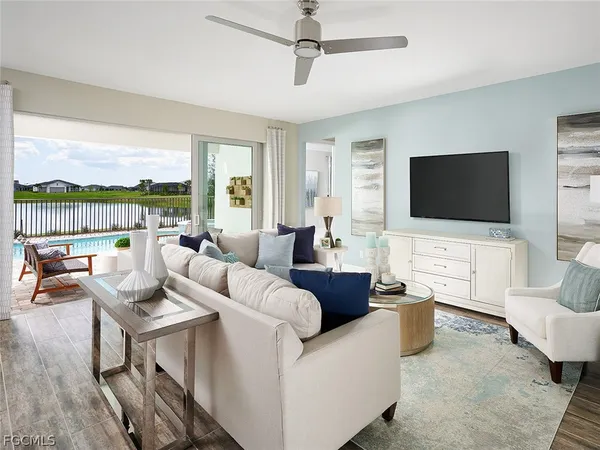 a living room with furniture and a flat screen tv